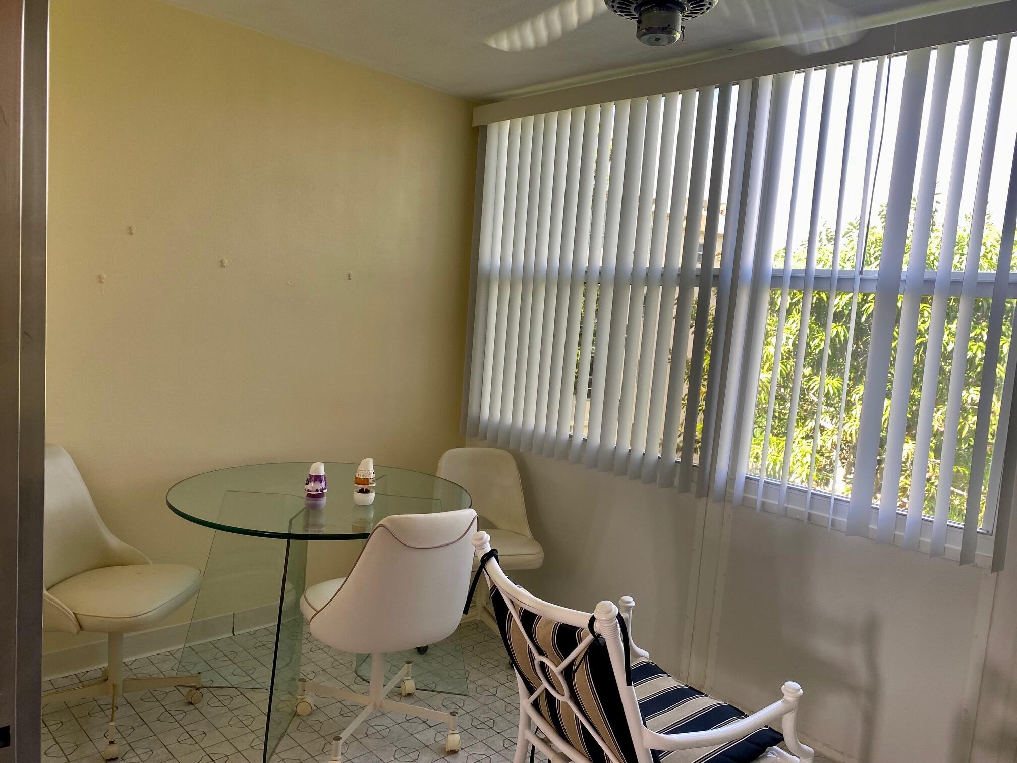 2615 Northeast 3rd Street, Unit 302 Boynton Beach, FL 33435 - Photo 14 of 14 a bathroom with a toilet and a window