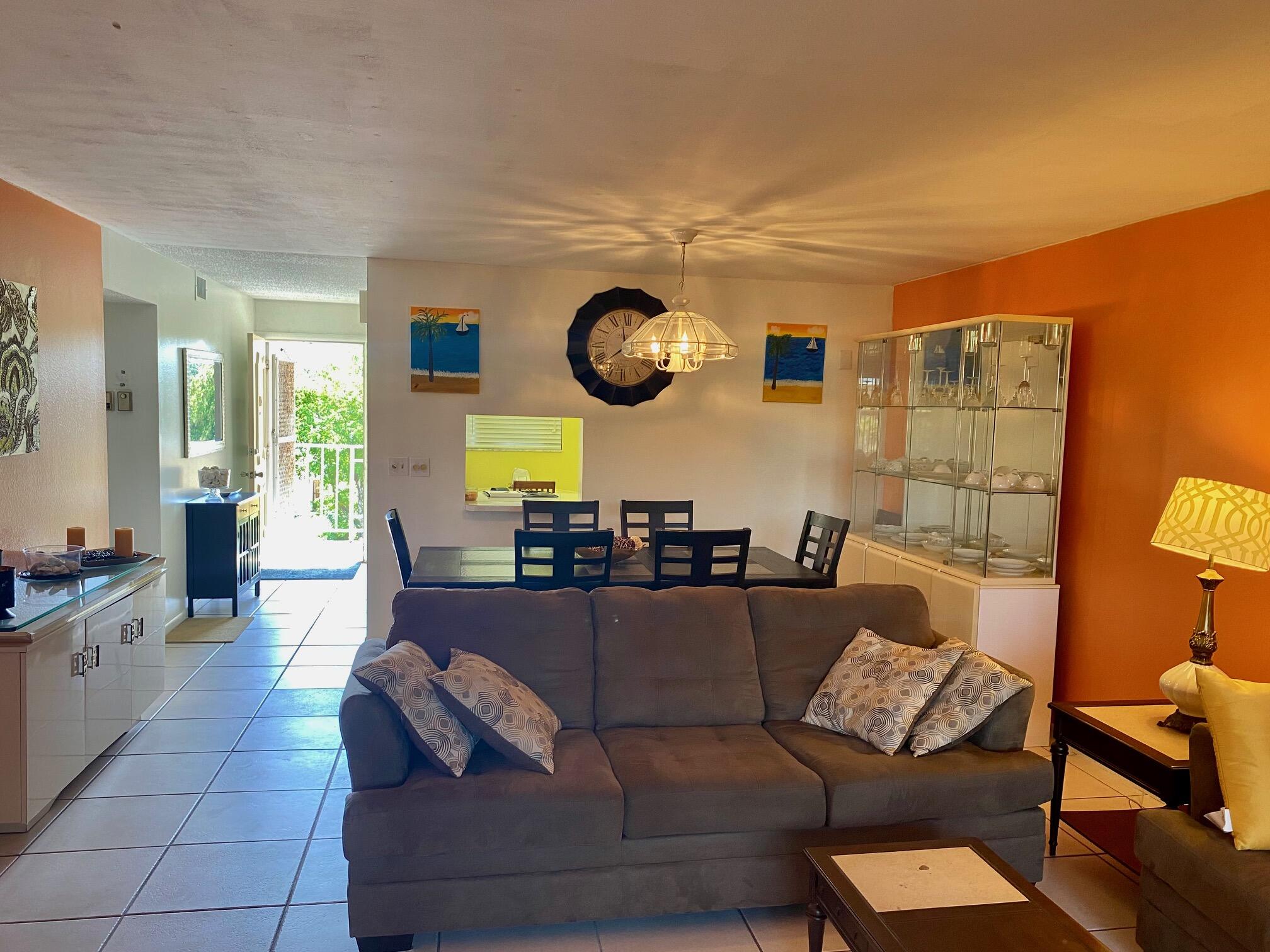 2615 Northeast 3rd Street, Unit 302 Boynton Beach, FL 33435 - Photo 2 of 14 a living room with furniture and a large window