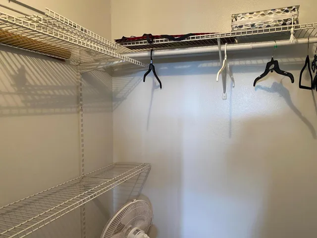 a view of a room with racks on the wall