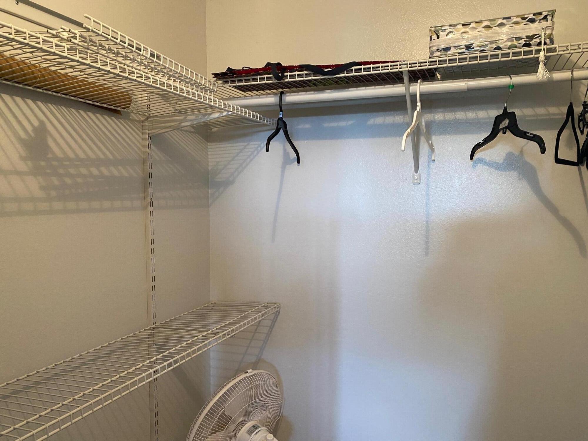 2615 Northeast 3rd Street, Unit 302 Boynton Beach, FL 33435 - Photo 9 of 14 a view of a room with racks on the wall