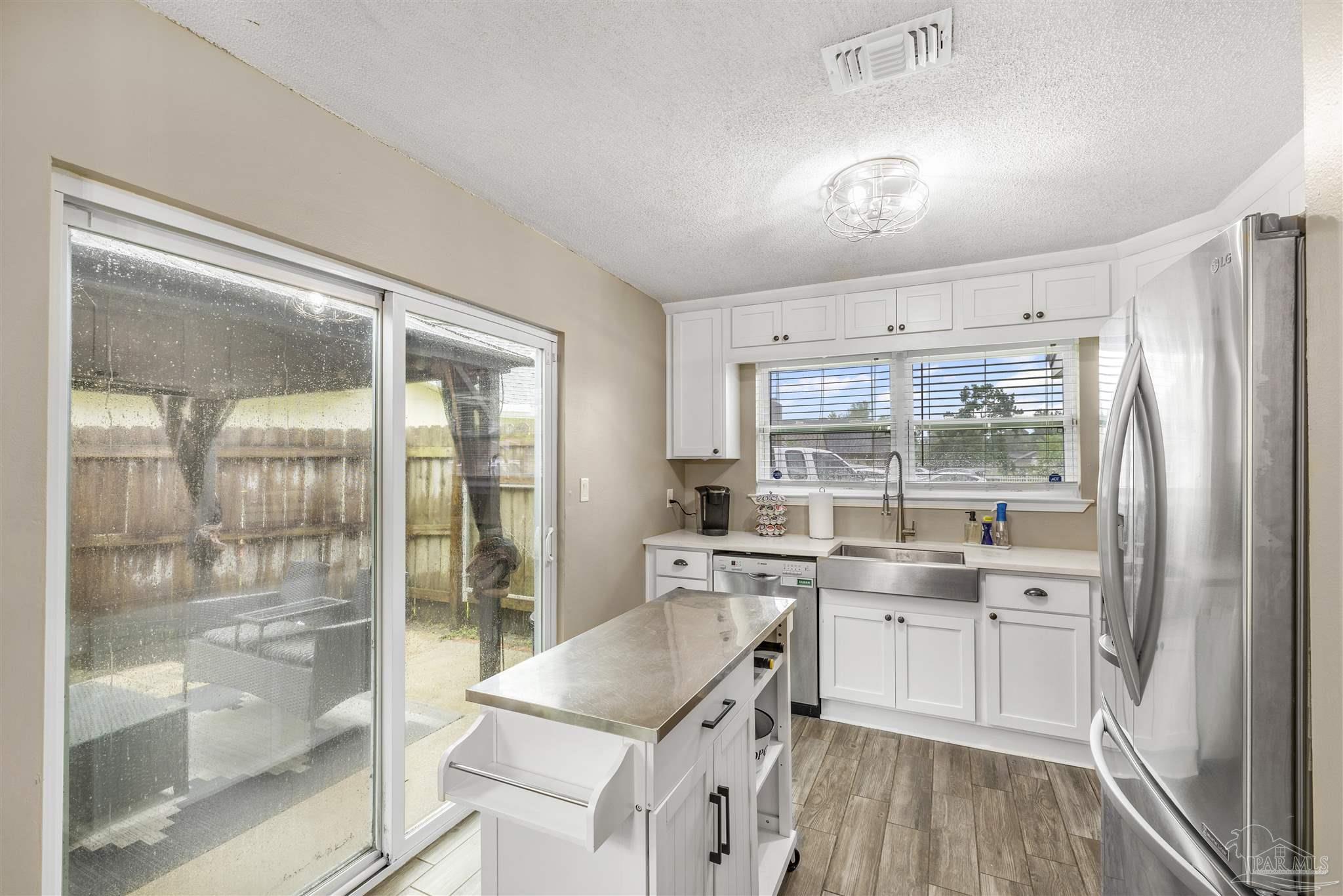 1833 Hunters Path Fort Walton Beach, FL 32547 - Photo 16 of 44 a kitchen with a sink stove and refrigerator