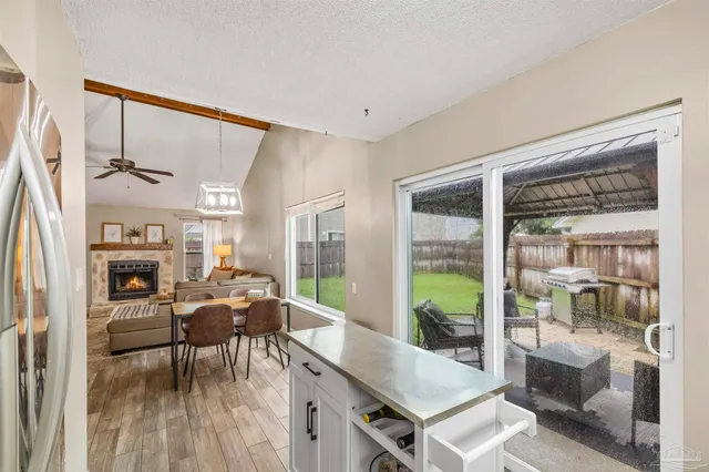 a kitchen with stainless steel appliances a stove microwave and sink