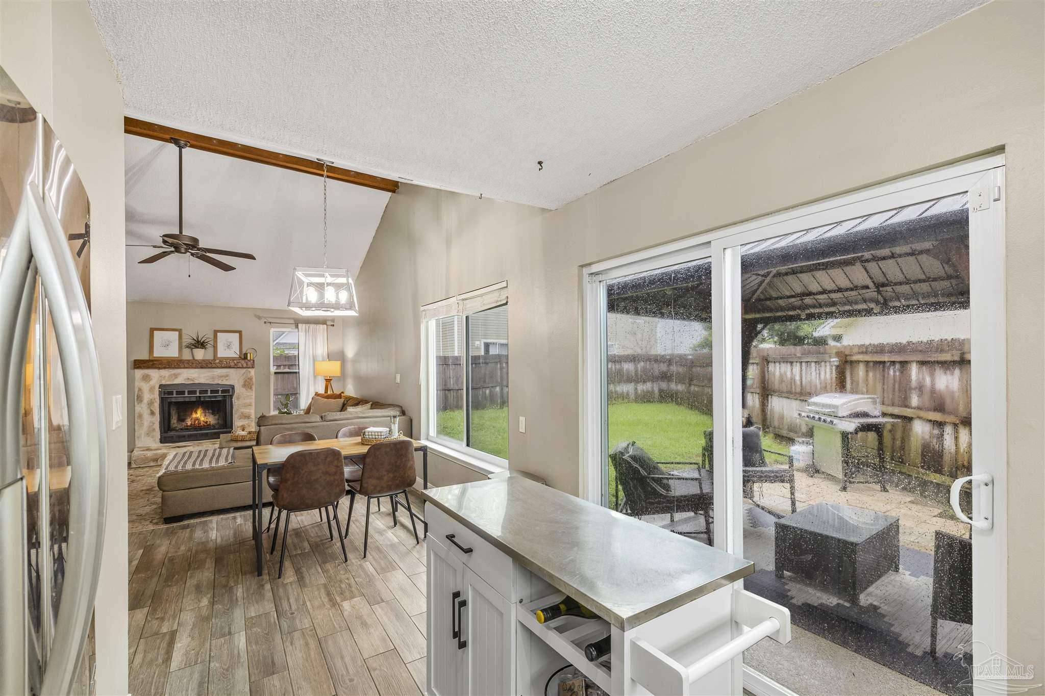 1833 Hunters Path Fort Walton Beach, FL 32547 - Photo 17 of 44 a living room with furniture a fireplace and a table