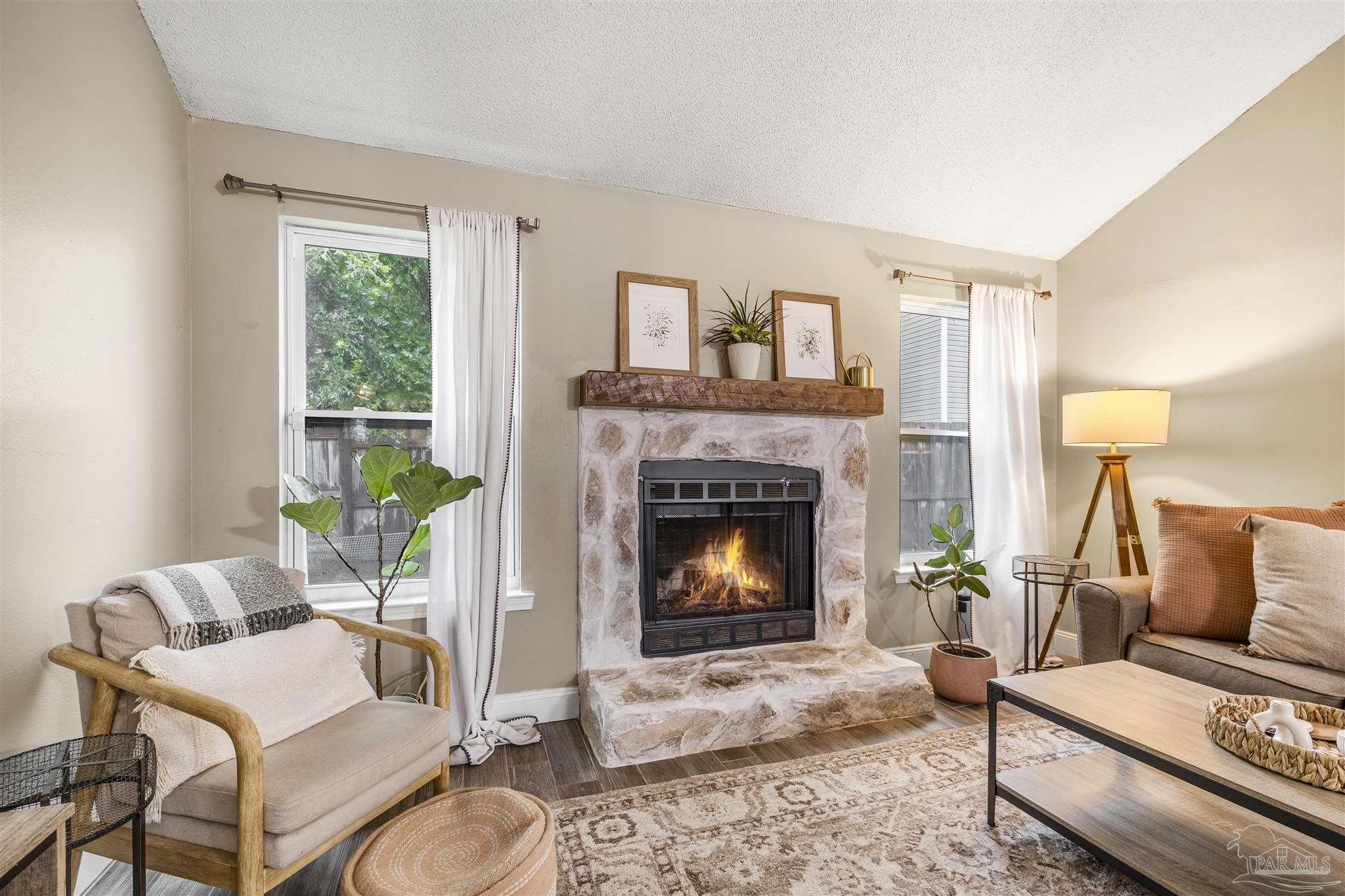 1833 Hunters Path Fort Walton Beach, FL 32547 - Photo 2 of 44 a living room with furniture and a fireplace