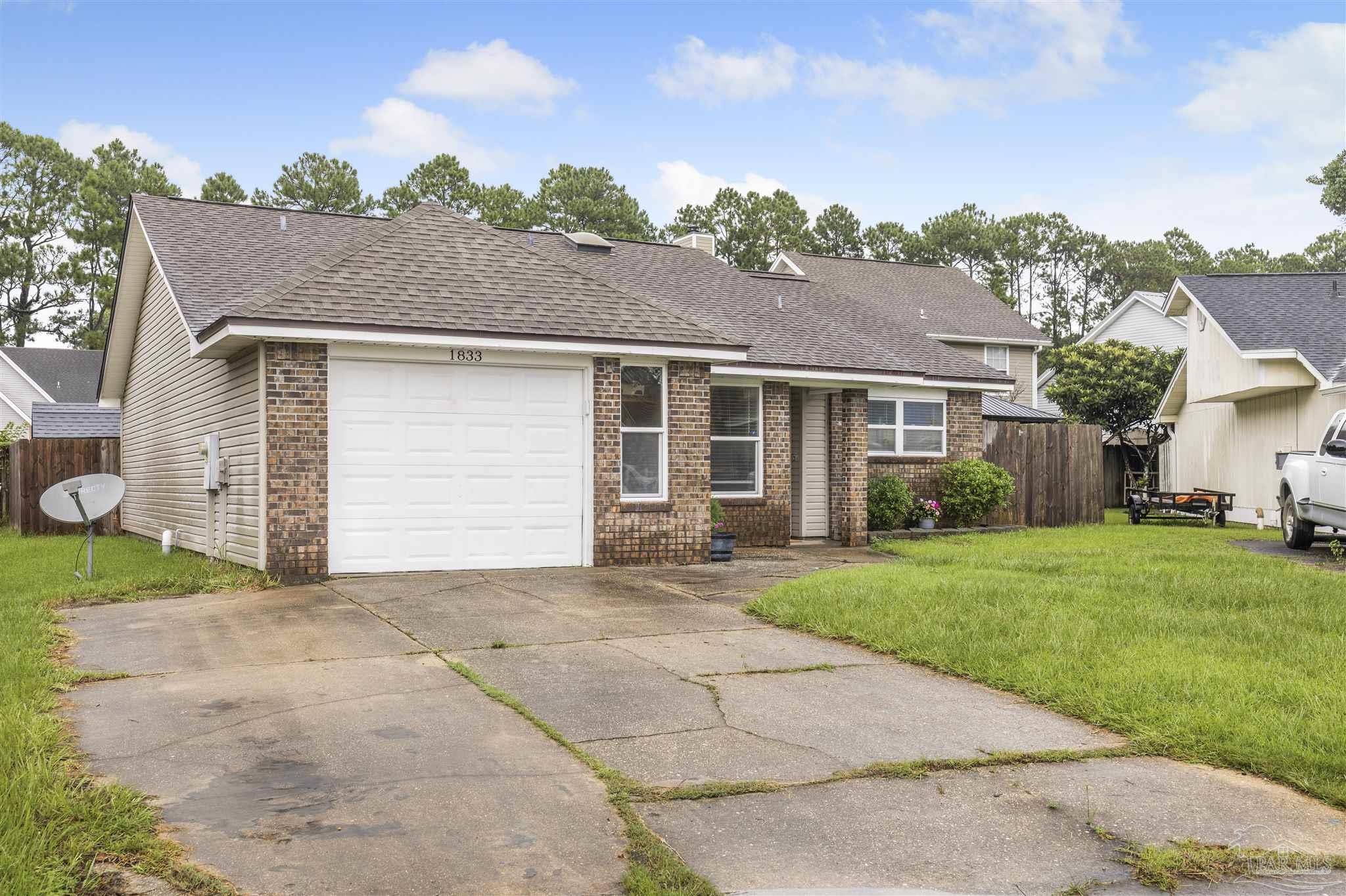1833 Hunters Path Fort Walton Beach, FL 32547 - Photo 31 of 44 front view of a house with a yard