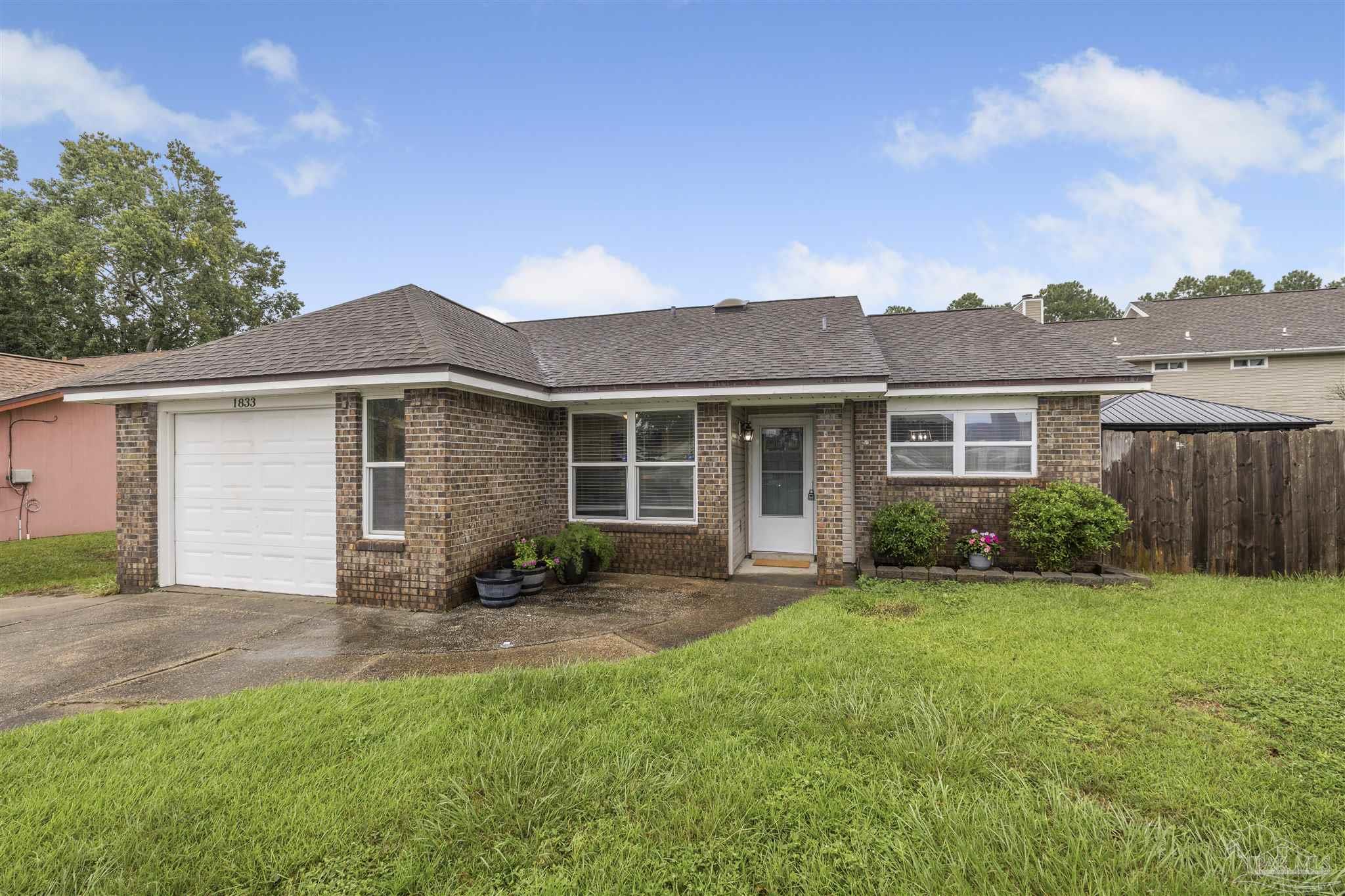 1833 Hunters Path Fort Walton Beach, FL 32547 - Photo 33 of 44 front view of a house with a yard