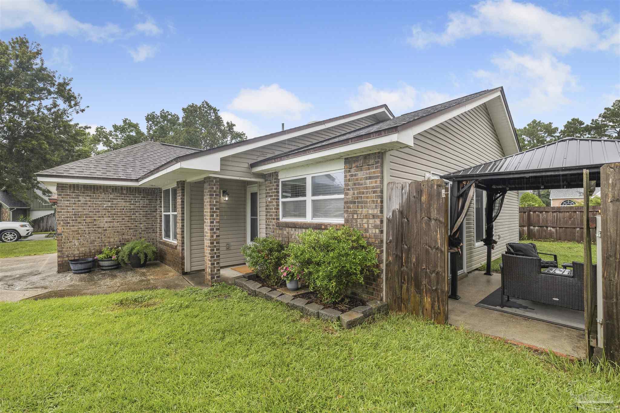 1833 Hunters Path Fort Walton Beach, FL 32547 - Photo 35 of 44 front view of house with a yard