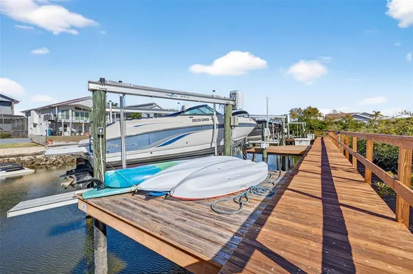 a room with pool table and windows