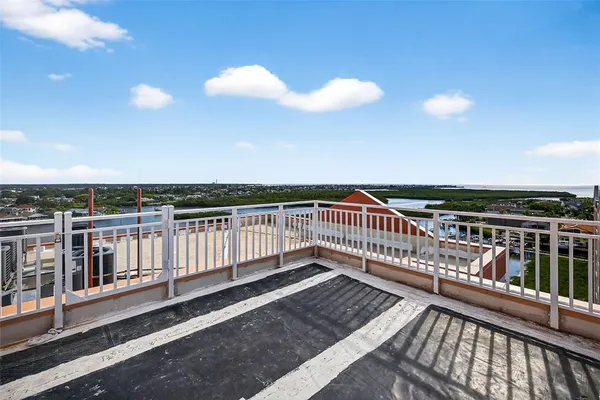 a view of a livingroom with workspace and a window