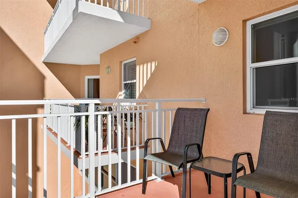a view of balcony with furniture