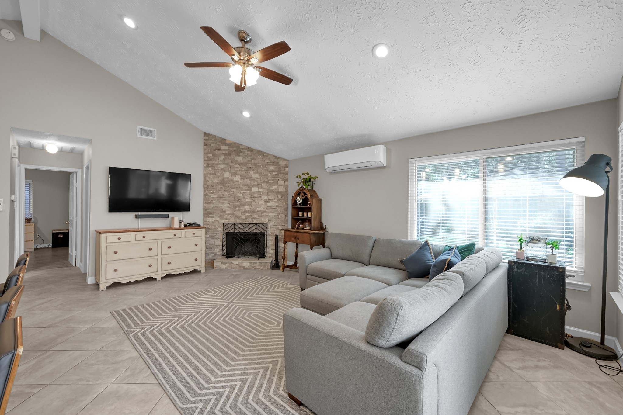 17323 Lowick Street Spring, TX 77379 - Photo 3 of 21 Vaulted ceilings make this home feel like it's 2,000+ sqft. The minisplit offers additional colling and efficiency.