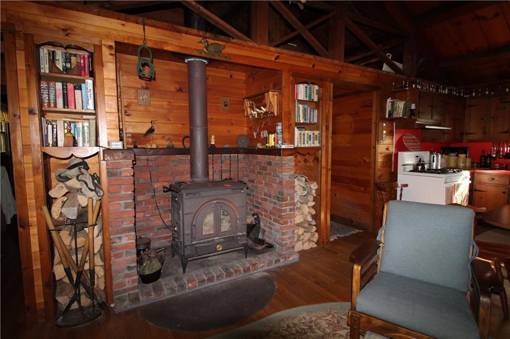 460 Birches Beach Road Oquossoc, ME 04964 - Photo 17 of 35 wood stove
