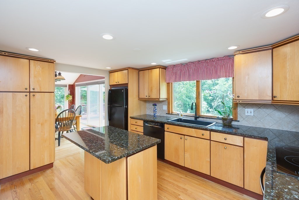 27 Algonquin Road Canton, MA 02021 - Photo 17 of 42 a kitchen with large window appliances and cabinets