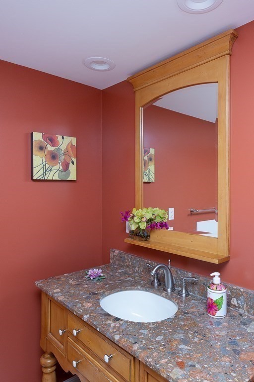 27 Algonquin Road Canton, MA 02021 - Photo 29 of 42 a bathroom with a sink vanity and a mirror
