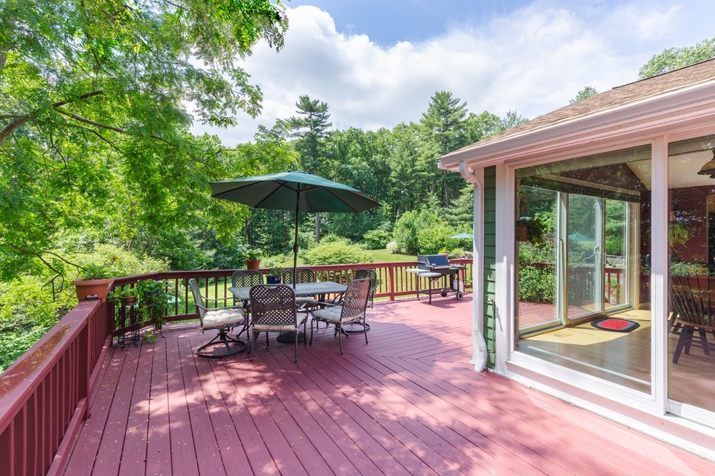 27 Algonquin Road Canton, MA 02021 - Photo 7 of 42 a view of a patio with a table chairs and backyard