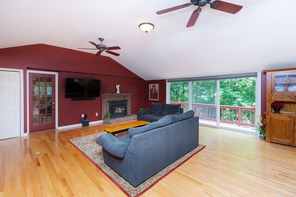 27 Algonquin Road Canton, MA 02021 - Photo 10 of 42 a living room with furniture pool table and a fireplace