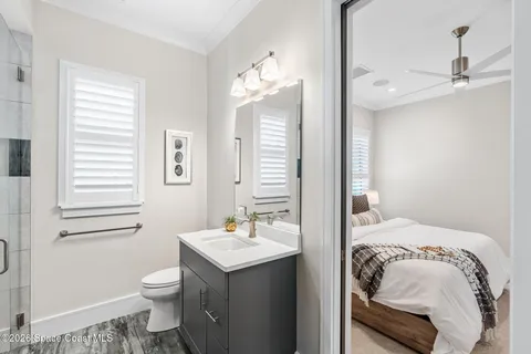 a bathroom with a shower and a sink