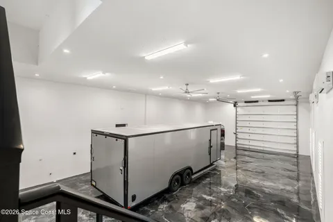 a living room with furniture a rug and a large window