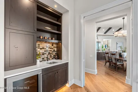 a view of kitchen with cabinets and wooden floor