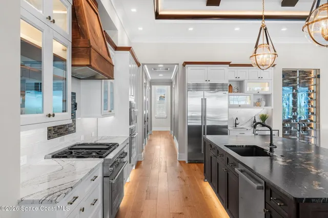 a living room with furniture a rug and a large window