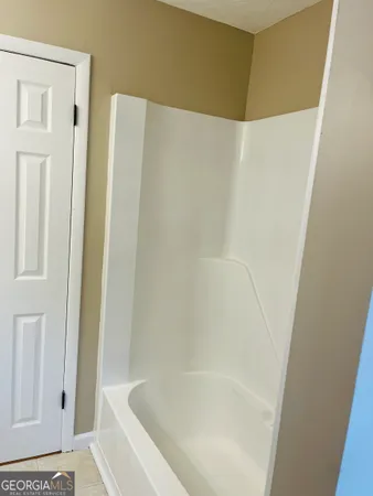 a bathroom with a bathtub