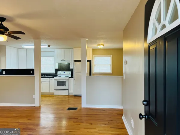 a view of kitchen with wooden floor