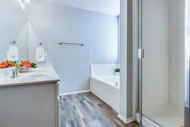 a bathroom with a tub and sink