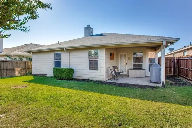 a front view of a house with a yard and porch
