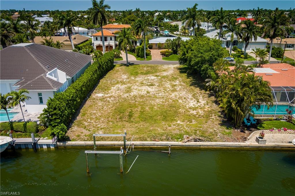 2165 Tarpon Road Naples, FL 34102 - Photo 6 of 24 an aerial view of residential houses with outdoor space and swimming pool