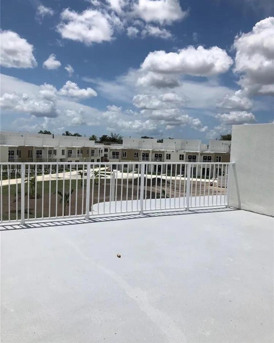 25869 Southwest 139th Path Homestead, FL 33032 - Photo 16 of 17 a view of balcony with city view