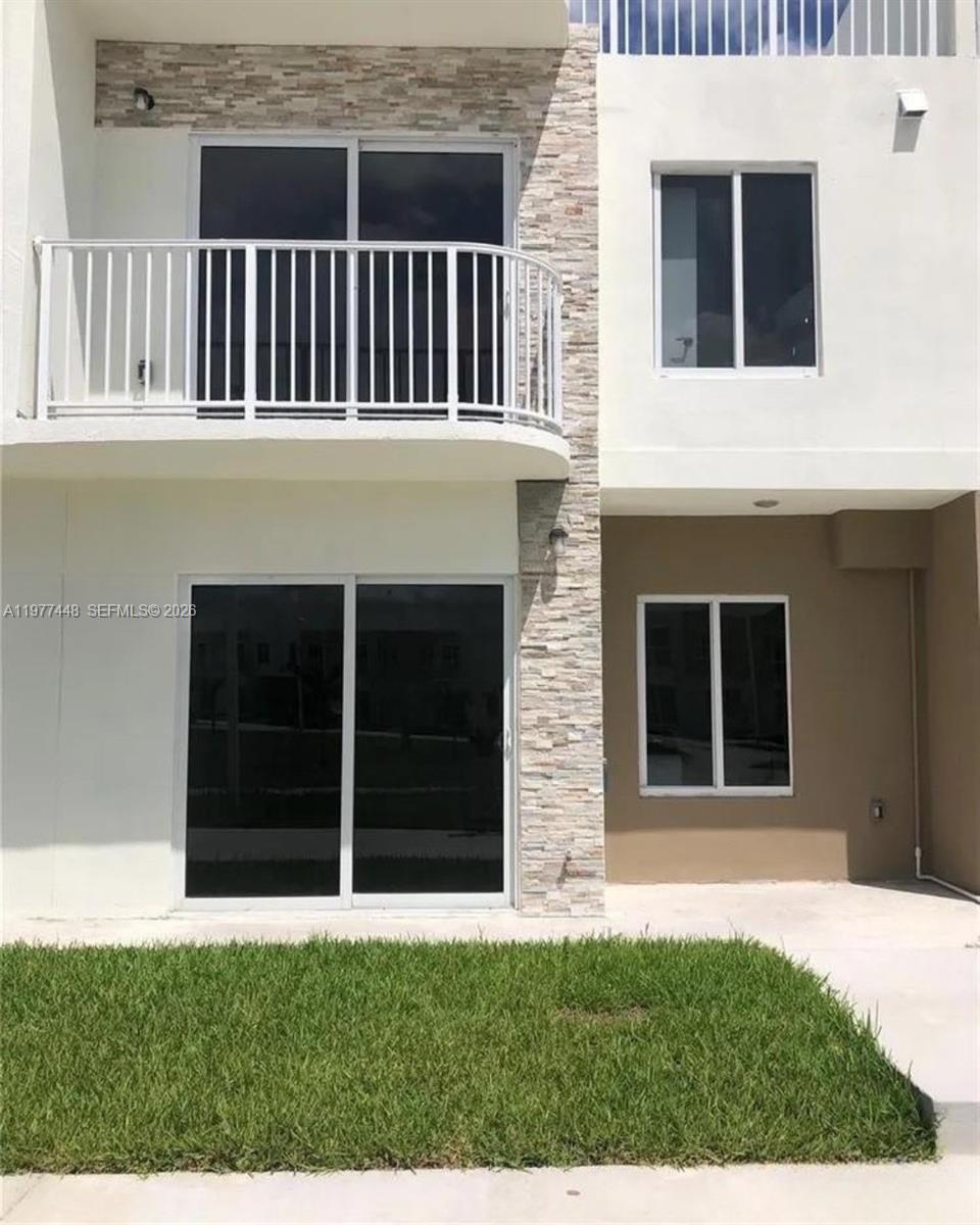 25869 Southwest 139th Path Homestead, FL 33032 - Photo 2 of 17 a view of a house with a yard