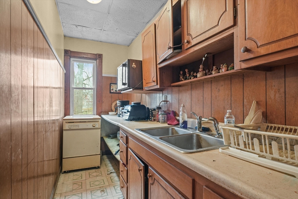 5-7 Arlington Terrace Lawrence, MA 01841 - Photo 13 of 39 a kitchen that has a sink and a stove in it