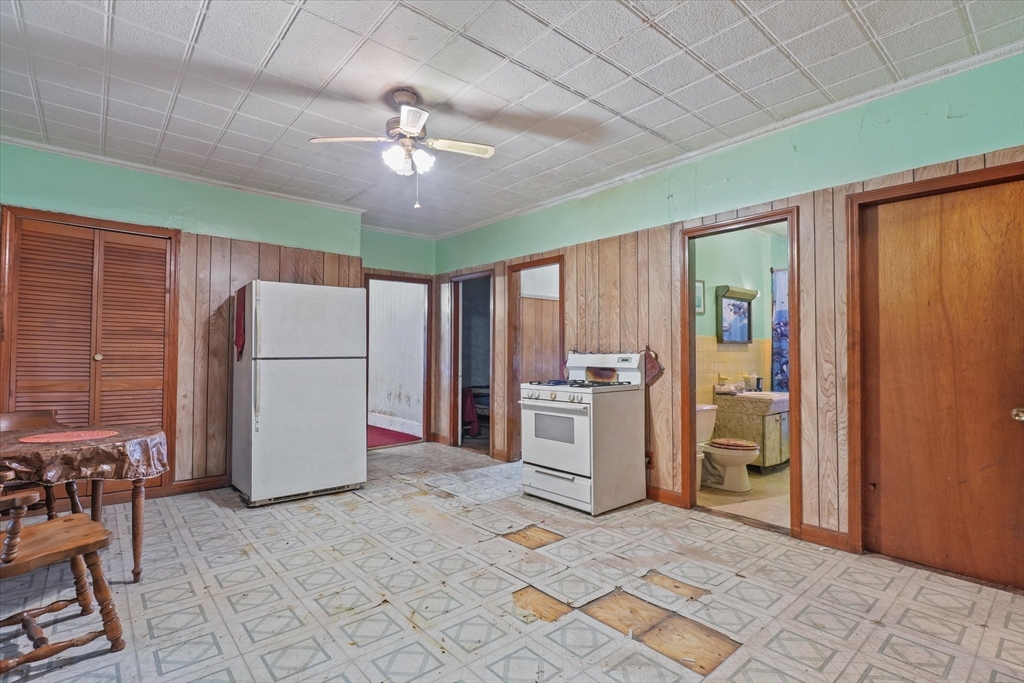 5-7 Arlington Terrace Lawrence, MA 01841 - Photo 16 of 39 a view of a kitchen with refrigerator and furniture