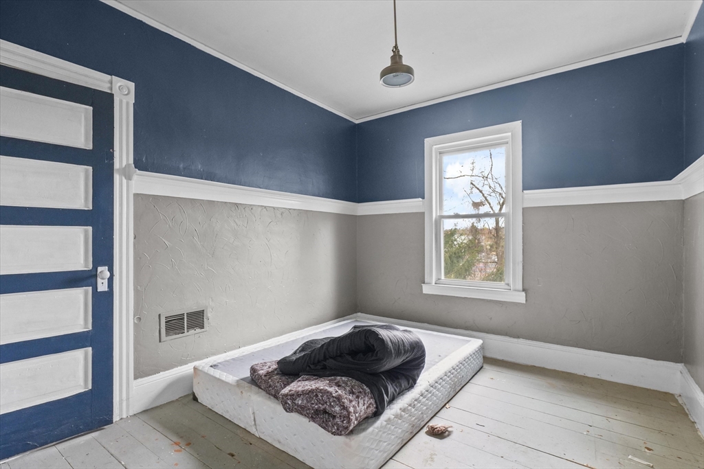 5-7 Arlington Terrace Lawrence, MA 01841 - Photo 24 of 39 a living room with furniture and a window
