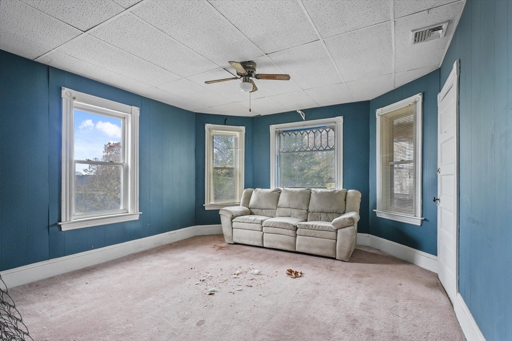 5-7 Arlington Terrace Lawrence, MA 01841 - Photo 25 of 39 a living room with furniture and a window