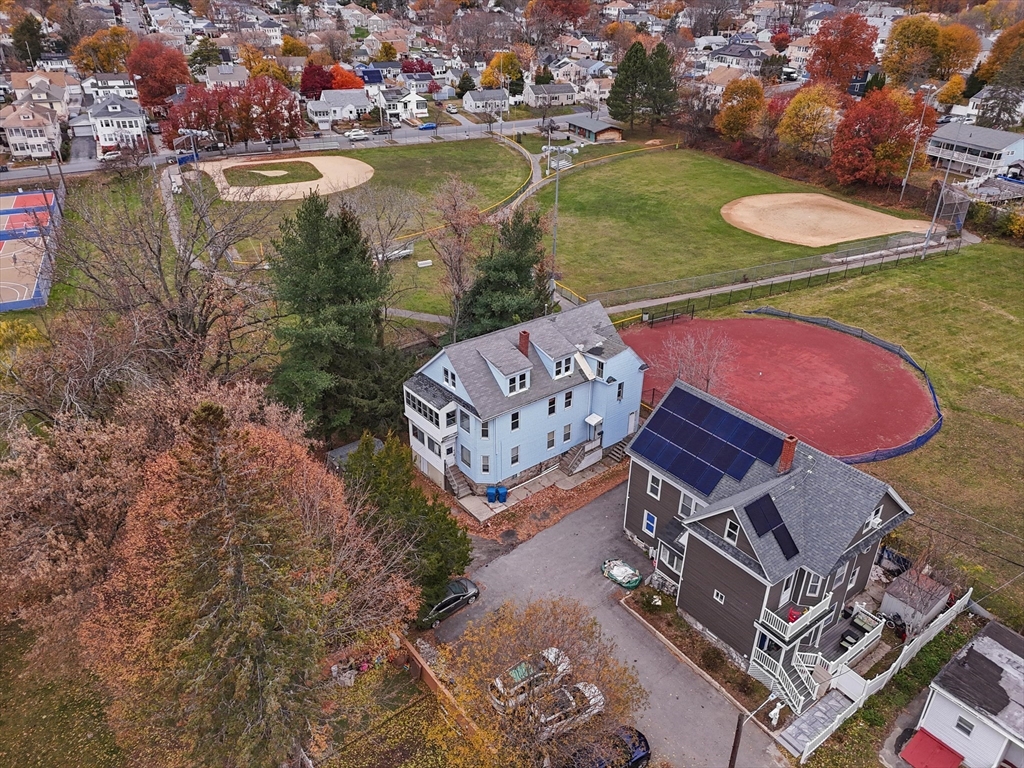 5-7 Arlington Terrace Lawrence, MA 01841 - Photo 3 of 39 an aerial view of a house with outdoor space