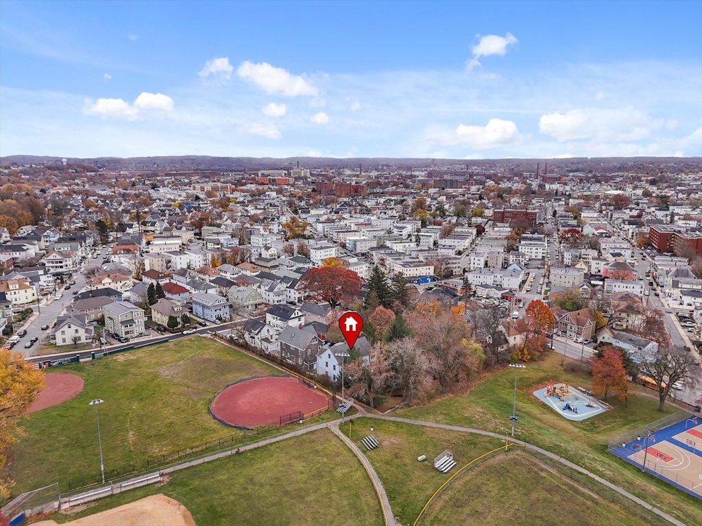5-7 Arlington Terrace Lawrence, MA 01841 - Photo 4 of 39 an aerial view of a house with yard