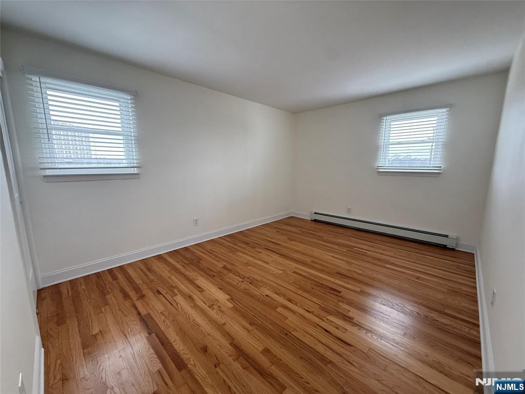 234 Wheeler Street, Unit 2 Cliffside Park, NJ 07010 - Photo 8 of 9 a view of empty room with wooden floor