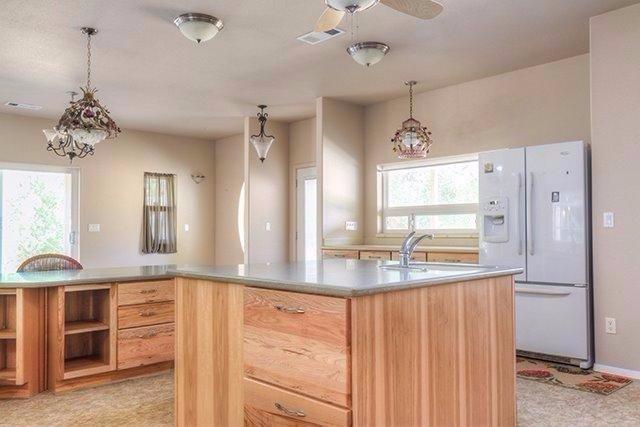 6555 Hugo Road Grants Pass, OR 97526 - Photo 8 of 31 Island and custom hickory cabinets.