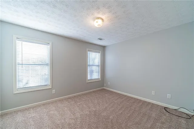 an empty room with closet area