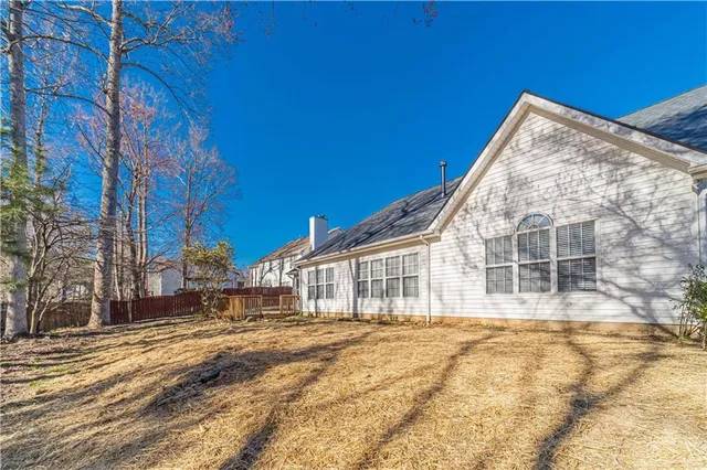 a view of a house with snow on the road