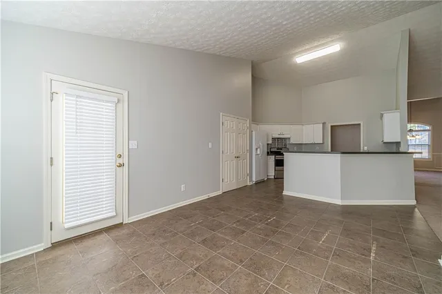 a view of a kitchen with a sink cabinets and a refrigerator