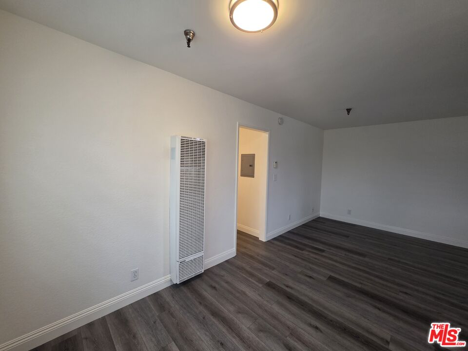 3204 139th Street, Unit 6 Hawthorne, CA 90250 - Photo 11 of 37 a view of an empty room with wooden floor