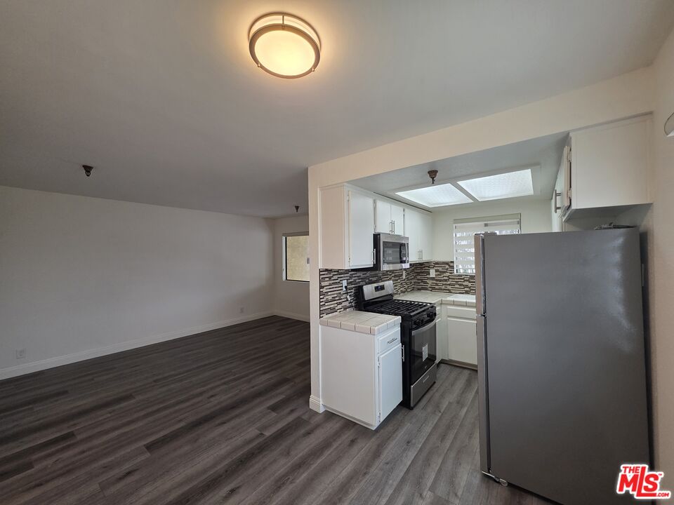 3204 139th Street, Unit 6 Hawthorne, CA 90250 - Photo 13 of 37 a kitchen with a refrigerator and a stove
