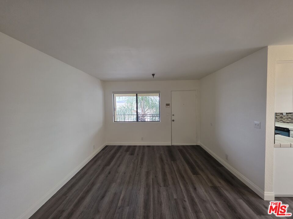 3204 139th Street, Unit 6 Hawthorne, CA 90250 - Photo 6 of 37 wooden floor in an empty room with a window