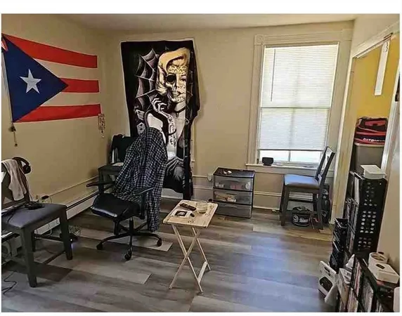a bed sitting in a bedroom next to a window