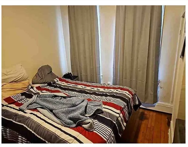 a bathroom with a toilet and a mirror