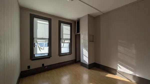 a view of an empty room with a window