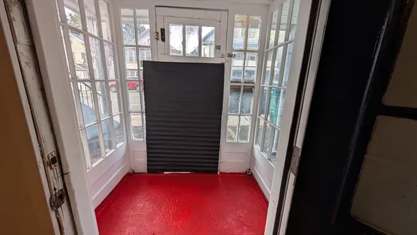 a view of entry way with wooden door