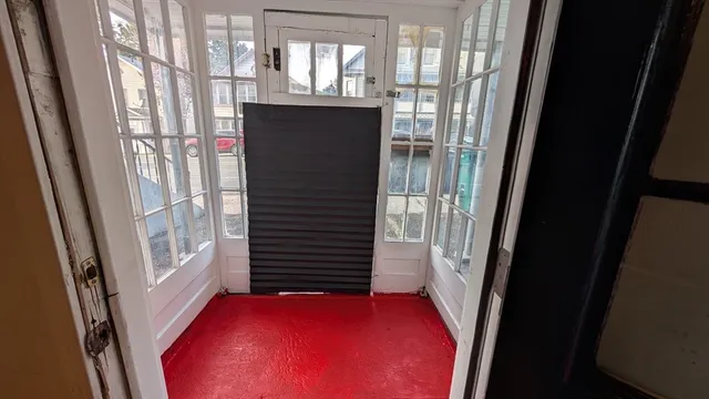 a view of entry way with wooden door